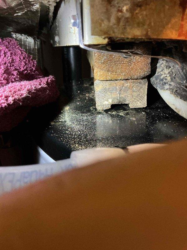 Responded to report of water leaking from air handler unit. Upon inspection, found water leaking from seams of air handler and evaporator drain hose. Discovered evaporator drain line was partially obstructed and flushed to clear blockage. Identified severely clogged air filter creating negative pressure in the system, which was preventing proper condensate drainage by drawing air through the drain line. Removed and replaced dirty air filter, which immediately restored proper drainage function. Advised occupant on importance of monthly air filter replacement to prevent recurrence of drainage issues. System tested and confirmed draining properly after service completion.