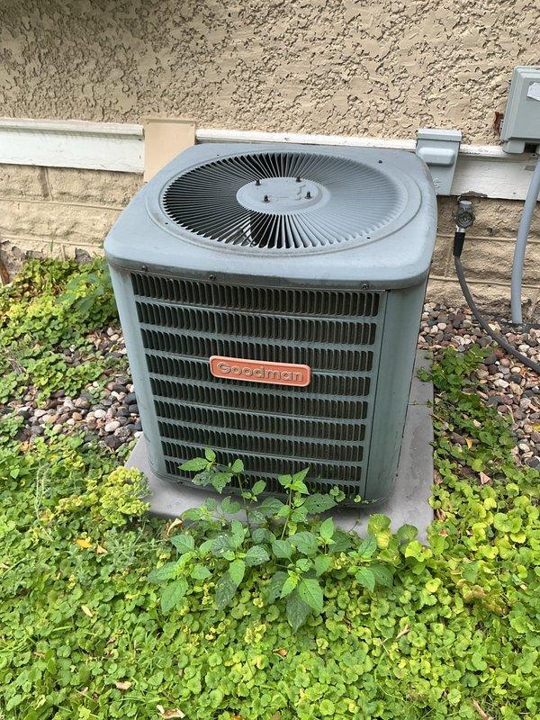 Responded to no cooling complaint on Goodman residential air conditioning system. Upon arrival, confirmed outdoor unit condenser fan was not operating while compressor attempted to run. Performed diagnostic testing and identified failed dual run capacitor as root cause of fan motor failure. Capacitor tested out of specification and showed signs of degradation. Removed defective capacitor and installed new replacement capacitor with proper microfarad ratings for both fan and compressor circuits. Reconnected all electrical terminals, verified proper wire routing and connections. Tested system operation and confirmed condenser fan motor now running at proper speed. Verified compressor starting and running normally. System cooling properly and operating within manufacturer specifications at time of departure.