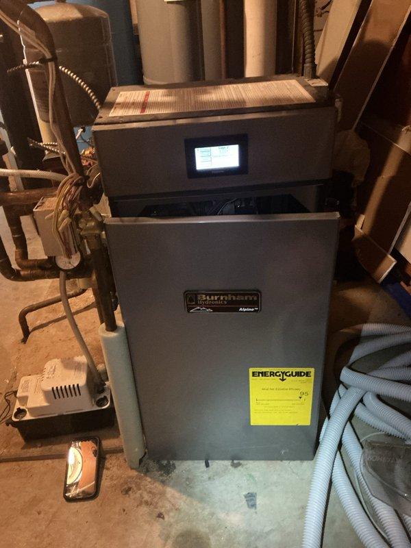Responded to no-heat call on Burnham boiler maintaining only 75-80 degrees water temperature. Found unknown fault code in system history indicating ignition failure. Upon inspection, discovered flame sensor was corroded and structurally compromised with loose rod assembly, and igniter showed heavy corrosion. Camera inspection of heat exchanger revealed significant rust buildup throughout, consistent with lack of maintenance over 16-year service life. Reset system to restore temporary operation. Provided estimate for flame sensor replacement, igniter replacement, and comprehensive boiler cleaning service. Parts ordered for follow-up appointment to complete repairs and perform full system tune-up. Unit currently operational but requires scheduled maintenance to ensure reliable long-term performance.