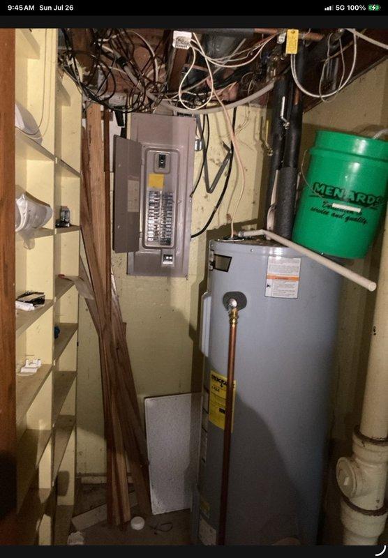 Responded to return service call for no-cool condition at residence with 1970s-1980s vintage General Electric outdoor condensing unit and 31-year-old furnace. Customer reported breaker tripped that morning and outdoor fan motor not rotating. Upon inspection, found condensing unit severely deteriorated with compressor wiring and condenser fan motor wiring insulation fully degraded and brittle throughout. Previous visit two weeks prior had temporarily restored cooling operation after clearing heavy brush and debris from around outdoor unit to improve condenser airflow; at that time also identified and discussed crimp crack in heat exchanger area of furnace. Due to extensive wiring degradation and difficult access to compressor terminals, electrical testing of compressor windings was not performed to avoid creating additional damage or unsafe electrical conditions. Advised customer to leave system off and not attempt operation pending replacement. Customer has met with service advisor and