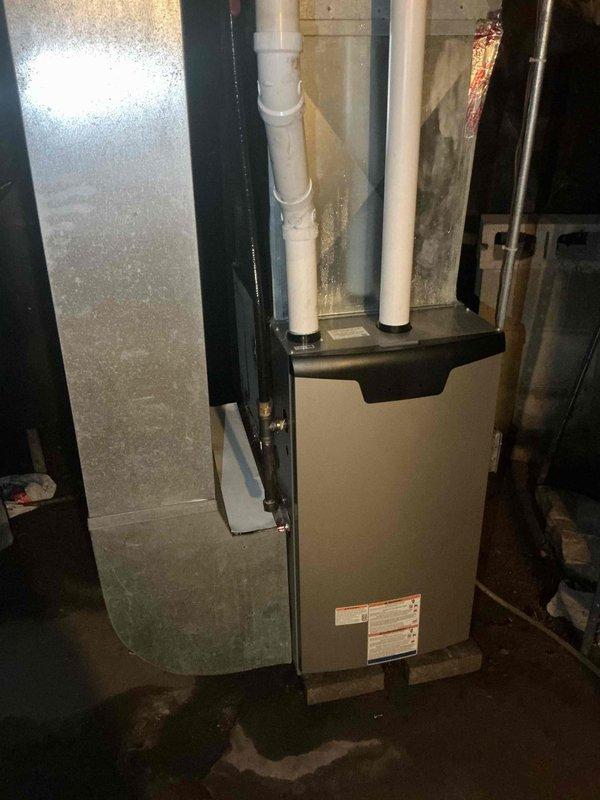 Responded to no cooling complaint on 1-year-old central air conditioning system. Upon arrival, confirmed outdoor condensing unit was operational but indoor blower motor was not running continuously. Performed diagnostic testing and found blower motor receiving proper voltage but cycling on and off intermittently. This malfunction caused evaporator coil to ice up, resulting in loss of cooling capacity. Tested blower motor at multiple speed settings to isolate the issue, confirming internal motor failure regardless of speed tap selection. Diagnosed faulty blower motor requiring replacement due to internal component failure preventing sustained operation. Replacement blower motor required to restore proper system function and airflow.