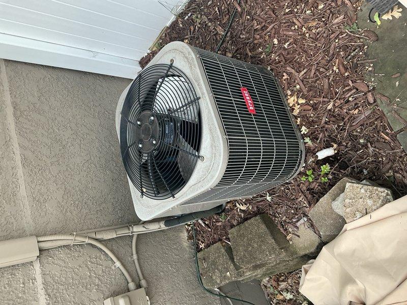 Responded to no cooling call on 11-year-old residential AC system. Upon arrival, homeowner reported outdoor condenser fan running intermittently and stopping. Diagnosed failed dual-run capacitor reading 32/0 MFD out of rated 35/5 MFD. Replaced defective capacitor with proper OEM replacement, restoring normal condenser fan operation. Performed complete system verification including contactor inspection, refrigerant charge analysis, air filter condition check, and temperature split measurements across evaporator coil. All parameters confirmed within manufacturer specifications. System returned to full cooling operation with no further issues detected.