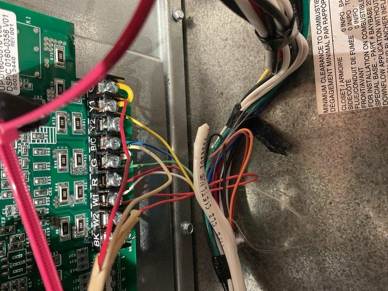 Responded to a no-cooling complaint on a Trane S9V2B080U gas furnace with Honeywell T10 thermostat. Performed systematic low-voltage troubleshooting to isolate the failure point. Verified 28 VAC present at R to C terminals on furnace control board, confirming transformer and control power circuit integrity. Measured Y to C during cooling call and found 0 VAC while indoor blower operated normally, indicating no cooling output signal from thermostat.

Tested outdoor unit and contactor circuit by jumping R to Y terminals at furnace board, which produced proper 28 VAC at contactor and successfully energized the condenser, confirming outdoor unit, field wiring, and contactor circuit were functional. Identified thermostat was wired using Honeywell wire-saver/K terminal configuration with no direct Y output at subbase. Determined the failure point was thermostat wire-saver control strategy or compatibility issue, not condenser circuit or outdoor unit malfunction.

Recommended abandoning wire-