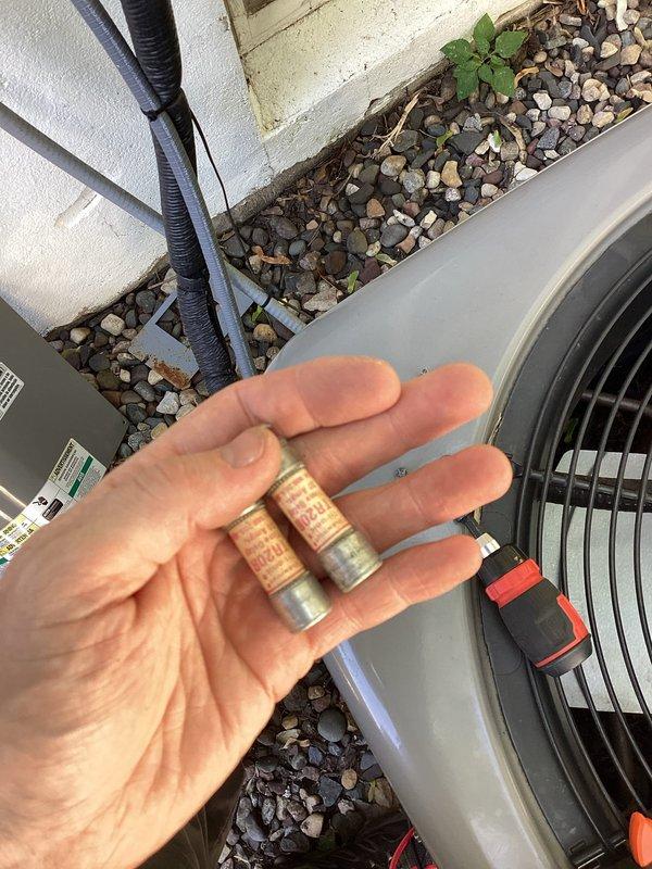 Responded to no cooling complaint on Rheem unit. Upon arrival, confirmed system was not operating with no fan activity. Diagnosed failed fuse in outdoor disconnect switch. Removed old fuse and installed replacement, restoring power to unit. Verified system operation with cooling and proper fan function before completing service.