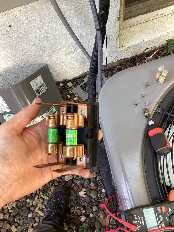 Responded to no cooling complaint on Rheem unit. Upon arrival, confirmed system was not operating with no fan activity. Diagnosed failed fuse in outdoor disconnect switch. Removed old fuse and installed replacement, restoring power to unit. Verified system operation with cooling and proper fan function before completing service.
