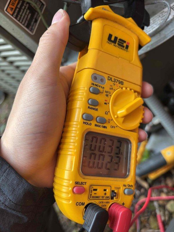Performed comprehensive AC maintenance on a 2-year-old single condenser system utilizing R-410A refrigerant. Conducted thorough inspection and testing of all major components including air filter, thermostat operation, temperature split differential, condenser unit, evaporator and condenser coils, blower and condenser motors, capacitors, compressor operation, refrigerant charge levels, and condensate drain line. All measurements and visual inspections confirmed proper system operation with ambient temperature at 82 degrees. Customer inquired about a broken fresh air duct cover connecting from the basement to the exterior that was recently replaced; advised to contact the installer regarding the defective cover. Utilized digital multimeter for electrical diagnostics and capacitor testing. System is operating within normal parameters at time of service completion.