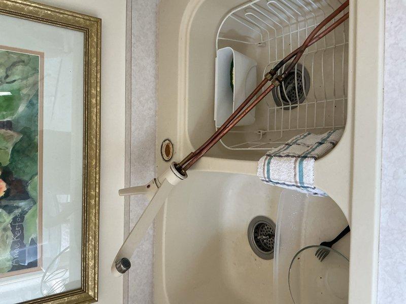 Completed installation of two customer-supplied kitchen faucets in separate sink locations. Addressed leaking under-sink valve during installation process. Both faucet installations were completed with proper supply line connections and tested for functionality.
