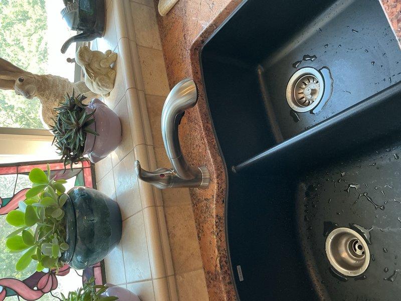 Completed installation of two customer-supplied kitchen faucets in separate sink locations. Addressed leaking under-sink valve during installation process. Both faucet installations were completed with proper supply line connections and tested for functionality.