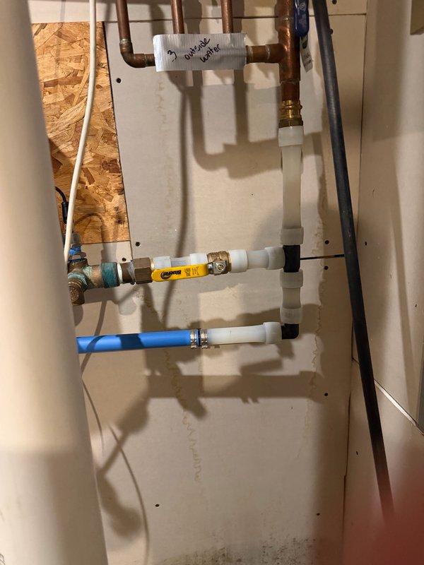 Responded to report of water accumulation in basement mechanical room. Upon inspection, identified condensation on multiple pipes and traced source to failed main ball valve showing active leak. Removed defective ball valve and damaged pipe section. Installed new ball valve with replacement piping to restore proper water supply control and eliminate leak condition.