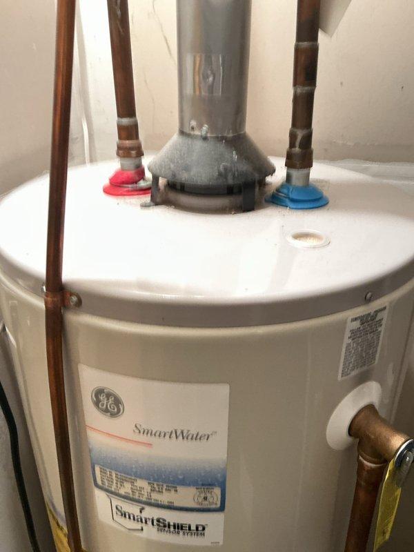 Responded to no cool complaint with water leaking near furnace in utility closet. Upon inspection, discovered active water leak originating from evaporator coil drain pan area on 25-year-old R22 air conditioning system. Determined leak was caused by either improper drain pan pitch or cracked drain pan at rear of coil. Additionally found evaporator coil improperly installed without coil shelf support—unit was resting only on screws mounted in plenum, contributing to drainage issues. System still operational but requires immediate attention to prevent water damage. Presented customer with options to further investigate and repair evaporator coil assembly or pursue full system replacement given age and R22 refrigerant status.