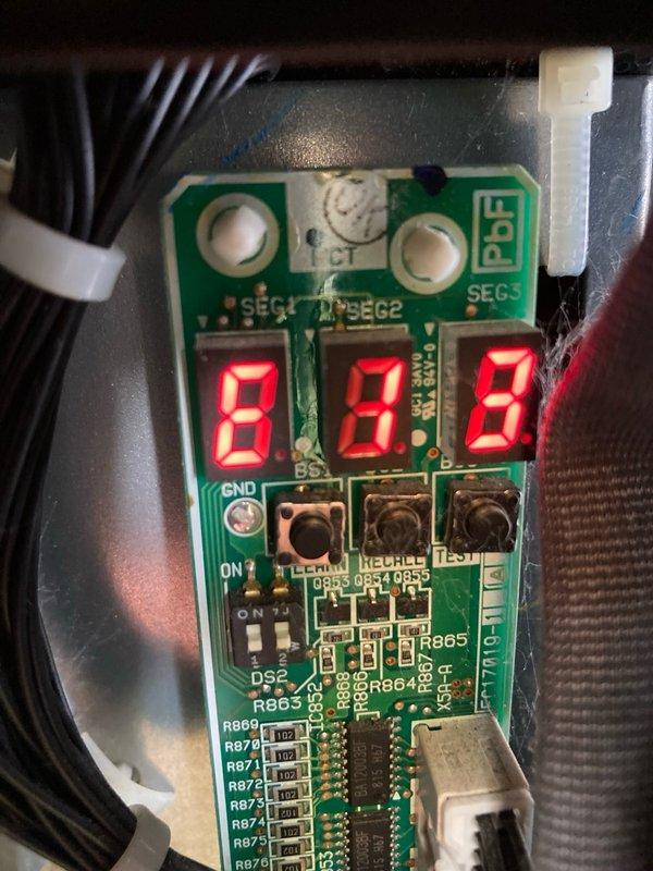 Responded to no cooling complaint on 6-year-old AC system displaying E13 high pressure switch lockout at outdoor unit and F5 communication error at furnace control board. Upon initial system startup, monitored refrigerant pressures which climbed to 515 PSI on high side with 25°F subcooling and 143 PSI on low side with 17°F superheat, indicating overcharge condition. Determined system was overcharged following recent evaporator coil replacement performed weeks prior. Recovered 6 lbs 7 oz of refrigerant from system rated for 82 oz factory charge. Recharged system with 5 lbs 2 oz refrigerant to manufacturer specifications. Allowed system to stabilize for 15 minutes and verified proper operation with corrected pressures of 434 PSI high side with 4°F subcooling and 147 PSI low side with 17°F superheat. Measured 19°F delta-T across indoor coil. Noted dirty air filter requiring replacement. Reset all error codes at thermostat, furnace control board, and outdoor unit. System operating normally