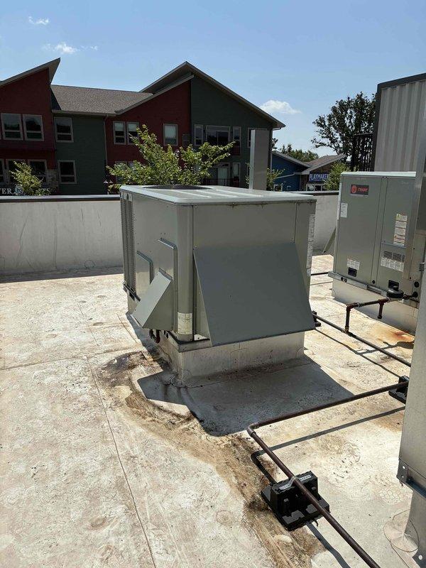 Responded to no cooling complaint on kitchen rooftop unit (RTU). Upon inspection, found 5-ton Trane unit operating properly but undersized for the large commercial kitchen space with high heat-generating equipment load. Unit unable to maintain adequate cooling capacity during extreme ambient conditions (95+ degrees), further impacted by makeup air unit introducing additional load. Verified unit maintaining dehumidification function with space temperature at 80 degrees, confirmed system performing at maximum design capacity but inadequate for current application demands.