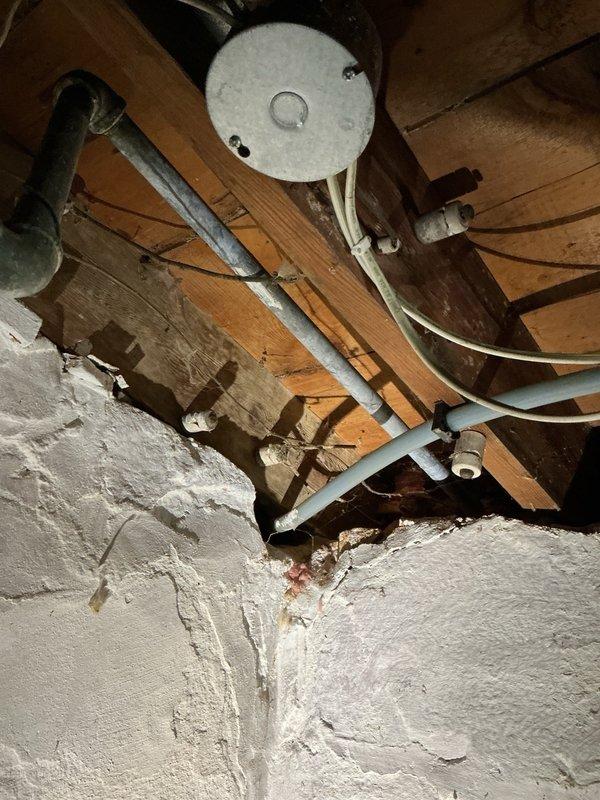 Conducted comprehensive plumbing assessment addressing multiple issues including two deteriorated exterior hose bibs requiring replacement, one with continuous dripping that could not be shut off. Inspected water heater exhibiting leak from overhead piping connections and insufficient recovery rate. Evaluated laundry room drainage problems where washing machine discharge and utility sink were improperly connected, causing water to drain directly onto floor rather than into proper waste lines. Provided estimate for immediate replacement of most severely compromised outdoor faucet and recommended scheduling comprehensive repair of all identified issues in single service visit for optimal efficiency.