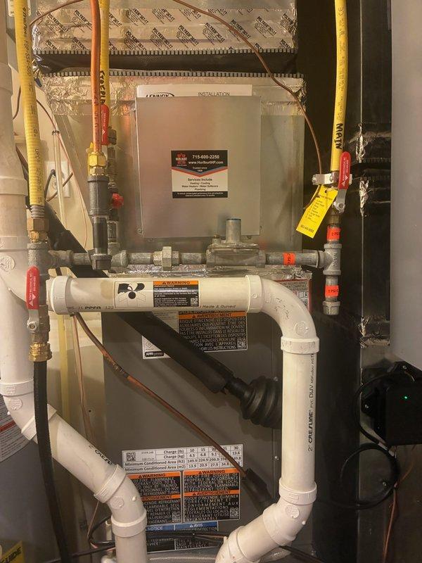 Responded to no cooling complaint on unit less than 10 years old. Upon arrival, system was empty of refrigerant following previous service visit where fluorescent dye had been injected for leak detection. Successfully located refrigerant leak at aluminum joint on condenser coil using UV leak detection equipment. Due to elevated mounting position of outdoor unit, coil replacement will require cutting unit down from current installation, removing and replacing condenser coil, then complete reinstallation of equipment. Recharged system with refrigerant to restore cooling operation temporarily. Unit currently operational but requires follow-up visit for condenser coil replacement and reinstallation to permanently resolve leak issue.