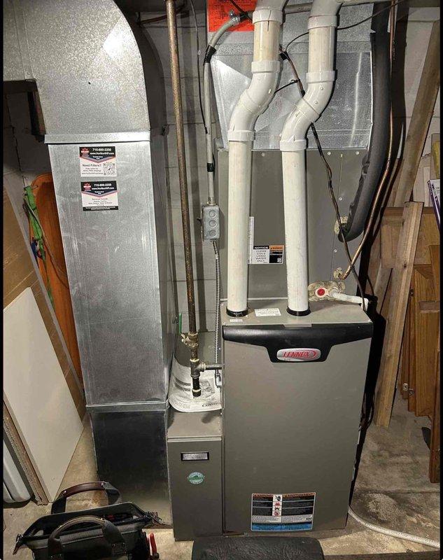 Responded to callback for insufficient cooling following recent maintenance on 2-ton residential A/C system. Upon arrival, thermostat set to 71°F with indoor temperature at 75°F during extreme ambient conditions (95°F outdoor temperature, 80% humidity). Installed gauges and measured refrigerant subcooling, which registered slightly elevated but within acceptable operating range. Determined unit capacity adequate for typical conditions but insufficient to overcome heat load from multiple contributing factors including active oven use, open tuck-under garage door, and extreme weather conditions. System operating properly with no mechanical defects identified. Provided customer education on managing internal heat sources and maintaining building envelope integrity during peak demand periods to optimize system performance.