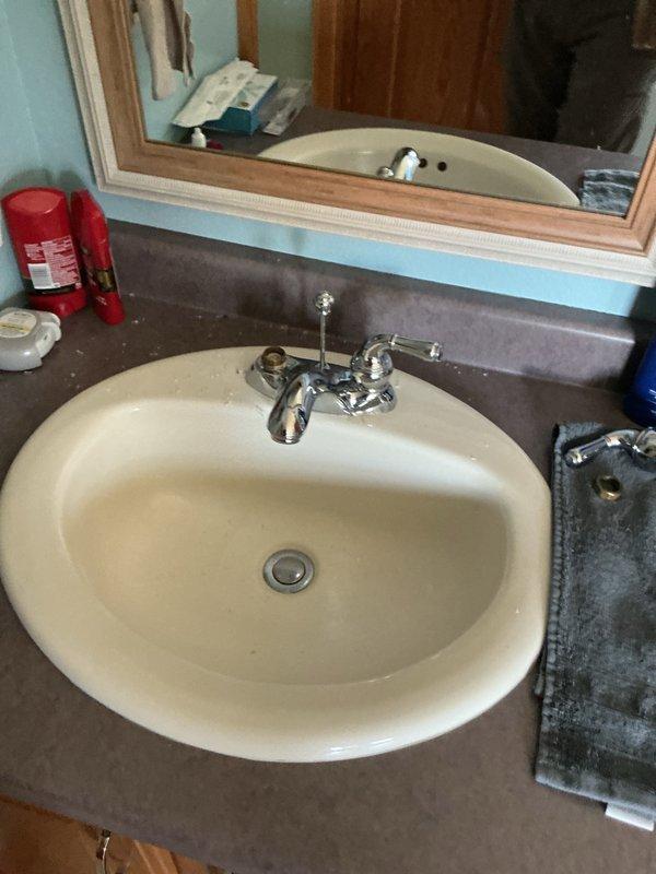 Removed garbage disposal unit and installed hard-piped basket strainer drain assembly at kitchen sink. Diagnosed and repaired leak at main level bathtub by replacing faulty faucet cartridge. Inspected second bathtub drain where customer reported previous leak but found no active leakage at time of service; advised customer to monitor. Attempted repair of bathroom sink faucet with seized hot side cartridge but cartridge was unable to be extracted due to corrosion and buildup; recommended complete faucet replacement for proper resolution.