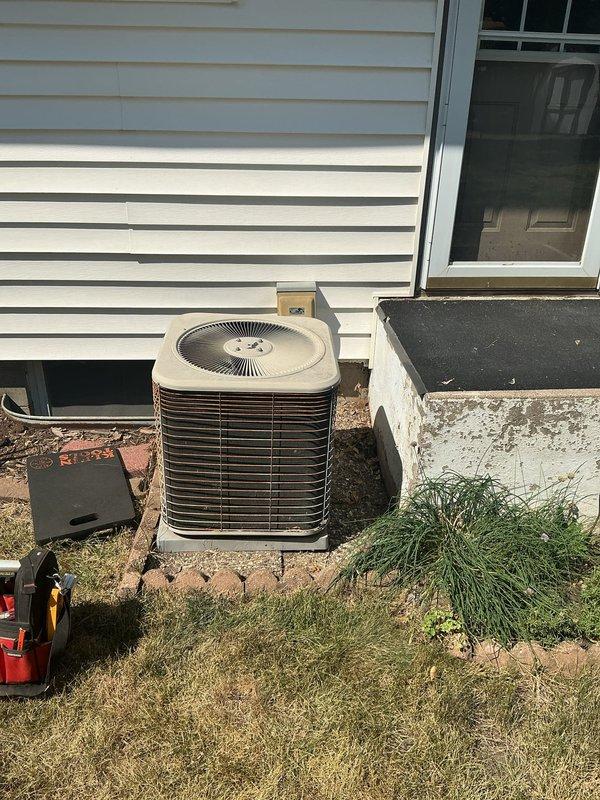 Responded to no cooling complaint on a 2012 residential air conditioning system. Upon arrival, found the outdoor condensing unit inoperative with customer reporting louder than normal motor operation prior to failure. Diagnostic testing identified a failed dual run capacitor preventing compressor and condenser fan motor operation. Replaced defective capacitor with proper OEM-spec replacement, restored power to unit, and verified normal compressor and fan motor startup with proper amperage draw. System cycled properly and returned to normal cooling operation.