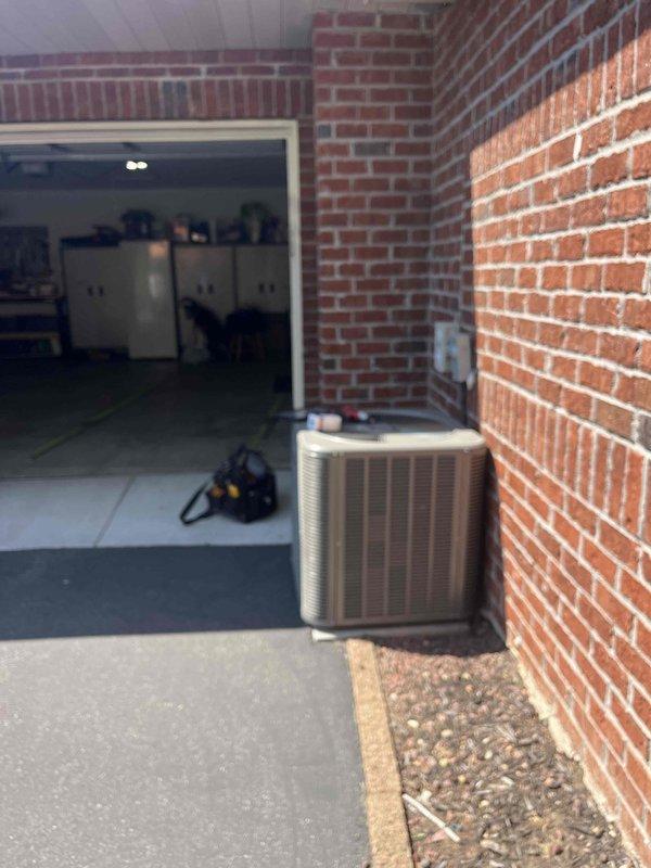 Responded to callback on 9-month-old AC installation with no cooling complaint. Upon diagnosis, confirmed compressor failure and identified improper installation with unit positioned directly against home exterior. Tested capacitor with digital multimeter to verify electrical component functionality. Replaced failed AC unit and relocated condenser 6 inches away from brick wall to ensure proper airflow and clearance per manufacturer specifications. Unit now operational with adequate spacing for maintenance access and optimal performance.