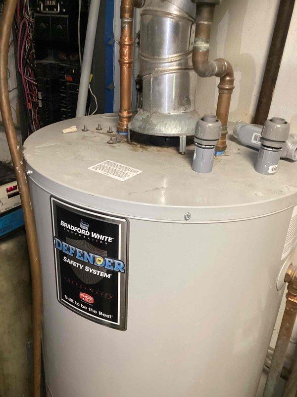 Responded to service call for furnace leaking water from bottom with concerns about installation quality. Upon inspection, identified water accumulation on floor and diagnosed low airflow issue caused by overly restrictive MERV 16 filter exceeding system specifications. Replaced filter with appropriate MERV 11 rated filter to restore proper airflow and system operation. Documented equipment conditions with photographs for service records.