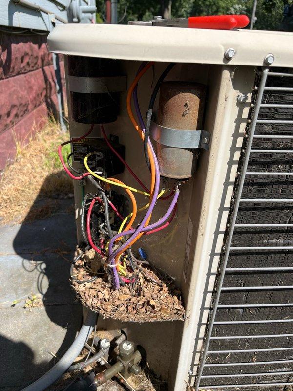 Responded to no-cool complaint on 15-year-old upstairs AC unit that had been running continuously without adequately dropping indoor temperature. Upon arrival, found system operational but performing poorly. Conducted diagnostic evaluation and discovered dirty air filter and failed dual-run capacitor at outdoor unit with hermetic terminal reading 0 microfarads, indicating compressor likely experienced intermittent starting failures. All other components including refrigerant pressures, electrical connections, and condenser coil were within normal operating specifications. 

Replaced failed capacitor with new component per manufacturer specifications. Verified system operation post-repair with all refrigerant pressures reading within acceptable range and confirmed temperature split exceeding 15 degrees across evaporator coil, indicating proper cooling capacity restored. Noted significant debris accumulation in outdoor unit electrical compartment that was cleared during service. System r