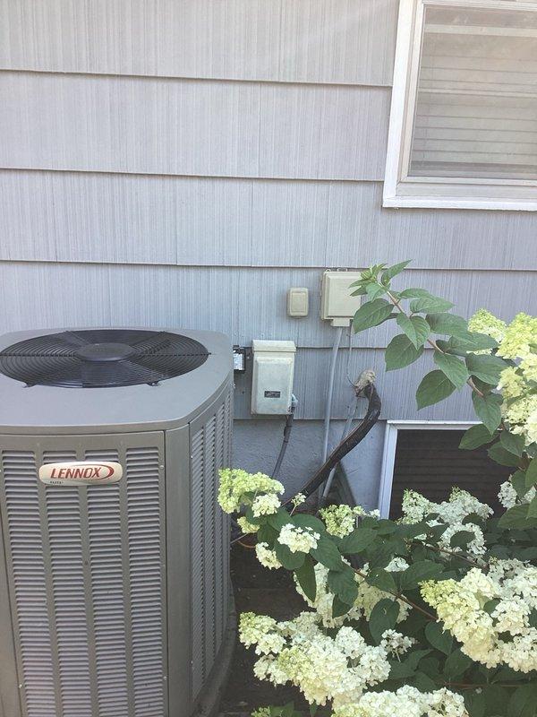 Responded to no cooling complaint on Lennox system installed one year ago. Upon arrival, confirmed indoor blower motor operating but outdoor unit not running. Diagnosed failed fuse in disconnect switch. Replaced both fuses in disconnect, restoring power to outdoor unit. Verified system startup and operation. Checked refrigerant charge and temperature split across evaporator coil—both within manufacturer specifications. Inspected outdoor condenser coil and found debris obstruction affecting airflow. Provided homeowner education on proper condenser coil cleaning procedures and recommended preventive maintenance agreement via email. System restored to normal operation with adequate cooling capacity.
