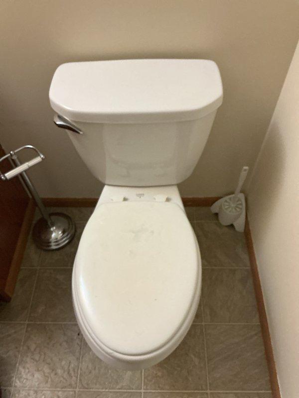 Responded to callback for toilet leaking around base following earlier service visit where toilet auger and tank parts were replaced. Upon inspection, identified water leaking from supply line connection and tank-to-bowl mounting bolts. Replaced worn mounting bolt nuts and retightened water supply line connection to manufacturer specifications. Verified all connections were secure with no active leaks. Toilet restored to proper working condition.