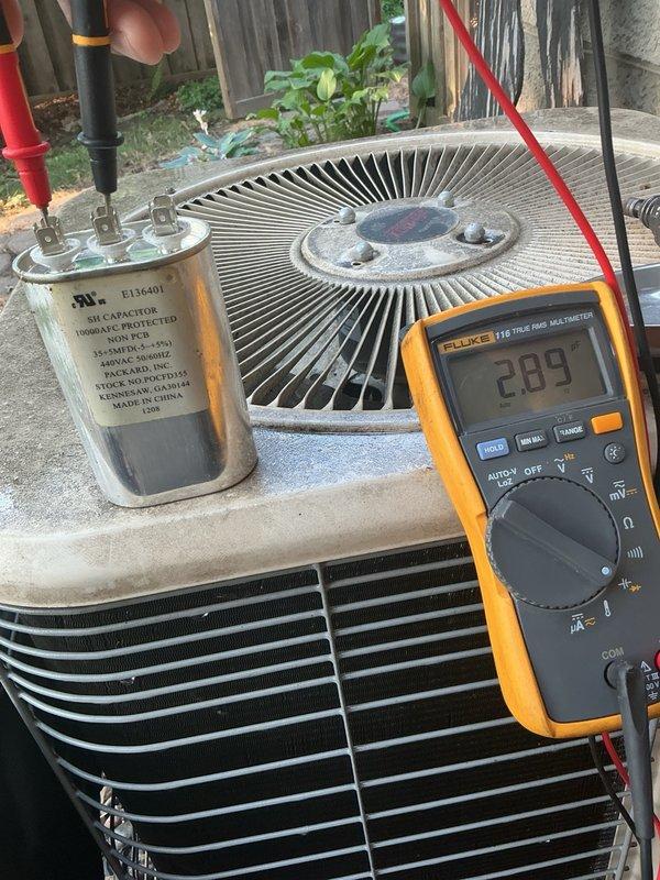 Completed annual cooling maintenance on a 2000 Lennox R-22 AC system and identified multiple critical components requiring attention. During inspection, discovered failing capacitor reading 28/2 MFD (rated 35/5 MFD) with visible residue on top, buzzing contactor, and low refrigerant charge with high side at 148 PSI (5°F subcooling, 81°F liquid saturation) and low side at 57 PSI (4.3°F superheat, 31°F vapor saturation). Performed standard maintenance procedures including air filter inspection, blower speed verification, condensate drain line flush, and exterior coil cleaning with 25-degree delta-T confirmed. Due to age of system and multiple failing components, scheduled follow-up appointment for system replacement estimate.