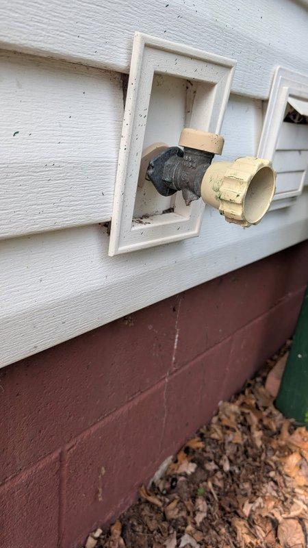 Responded to exterior plumbing issue involving a broken hose bib that had failed at the building's exterior wall connection point. Removed damaged hose bib assembly and installed new replacement unit, ensuring proper seal against the siding and secure mounting to prevent future leaks. Tested water flow and verified no leakage at connection points upon completion.