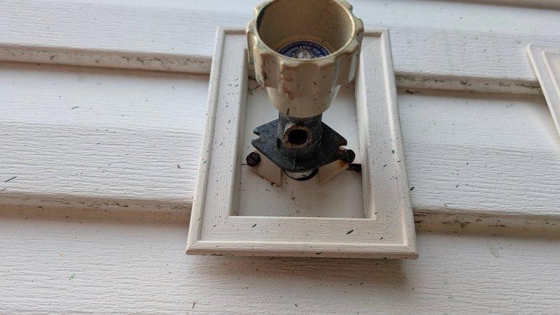 Responded to exterior plumbing issue involving a broken hose bib that had failed at the building's exterior wall connection point. Removed damaged hose bib assembly and installed new replacement unit, ensuring proper seal against the siding and secure mounting to prevent future leaks. Tested water flow and verified no leakage at connection points upon completion.