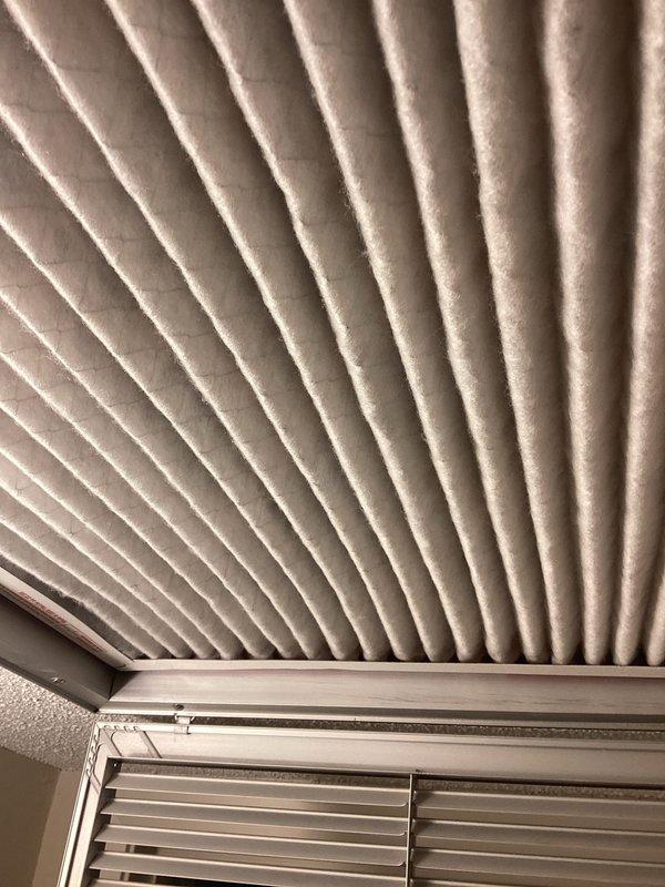 Performed AC tune-up on rooftop unit (RTU 4F). Removed cottonwood debris accumulation from condenser coil as requested and inspected air filter system. All components found to be in satisfactory operating condition with no additional issues identified during maintenance inspection.