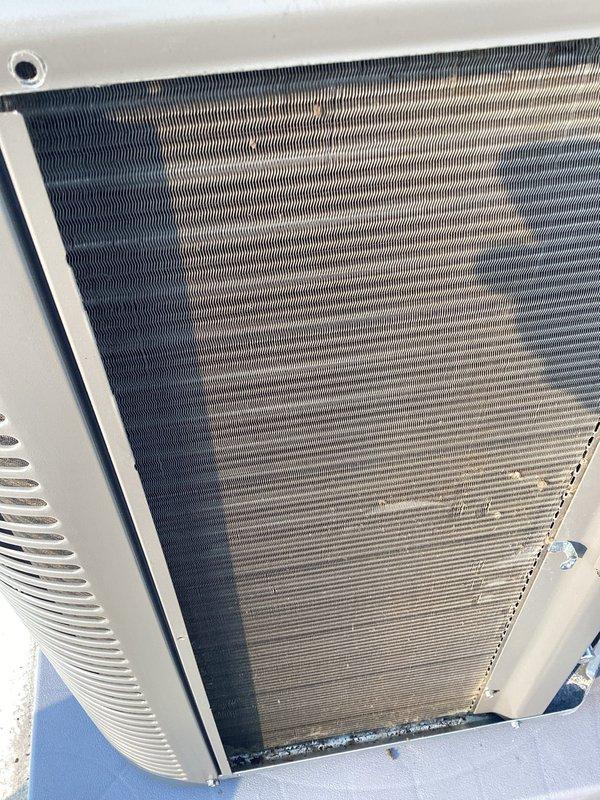 Performed AC tune-up on rooftop unit (RTU 4F). Removed cottonwood debris accumulation from condenser coil as requested and inspected air filter system. All components found to be in satisfactory operating condition with no additional issues identified during maintenance inspection.