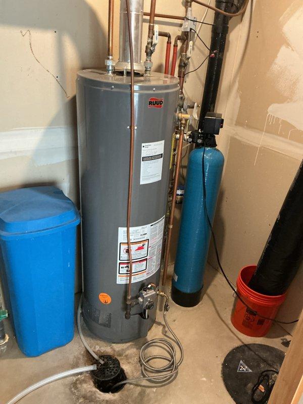 Completed comprehensive new member plumbing inspection of entire residential system. Performed visual inspection of all accessible plumbing fixtures, supply lines, drain lines, and water heating equipment. Flushed and drained hot water tank to remove sediment buildup and verified proper operation of RUUD water heater and associated copper supply piping. Inspected water softener system and confirmed operational status of control unit and valve assembly. Tested all plumbing fixtures throughout the residence to verify proper function and flow rates.

Identified minor issue with both faucets in master bathroom that exhibit leaking when excessive pressure is applied to handles, though fixtures operate normally under standard use conditions. Advised homeowner that these faucets will likely require cartridge replacement or repair in the near future to prevent potential worsening of leak condition. All other plumbing fixtures, supply lines, and drainage systems found to be functioning within n