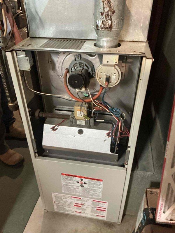 Responded to no-cool complaint on 27-year-old Tempstar R22 central air conditioning system experiencing intermittent failure during hot weather conditions. Customer reported unit blowing warm air after previous capacitor replacement provided only temporary 24-hour resolution.

Performed comprehensive diagnostic evaluation of entire system. Measured compressor starting and running load amperage, finding abnormally high readings even during cooler morning temperatures, indicating probable compressor overheating under thermal load conditions. Conducted thorough system inspection including refrigerant charge verification, capacitor testing, contactor inspection, condenser coil cleanliness assessment, furnace filter examination, and evaporator coil inspection. Measured temperature drop across evaporator at 18 degrees, confirming proper airflow and heat exchange within acceptable parameters.

All tested components—refrigerant charge, run capacitor, contactor, condenser coil, air filter, and 