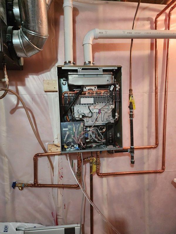 Responded to no hot water condition on Rheem tankless water heater displaying Code 11 error. Installed customer-supplied flush valve kit to enable routine maintenance and system flushing. Connected isolation valves to copper supply lines to facilitate future descaling procedures and cleaning of ignition components. Verified proper installation of flush port assembly and tested valve operation to ensure system accessibility for ongoing maintenance requirements.