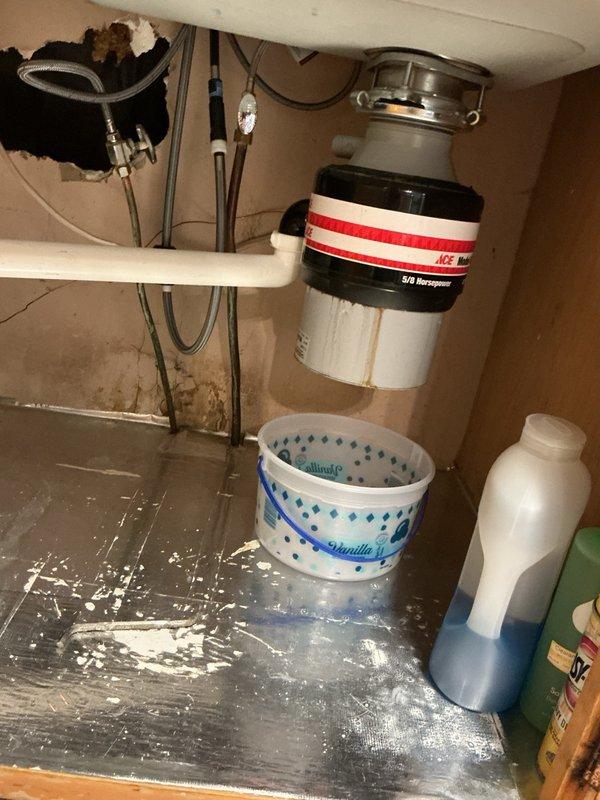 Responded to service call for seized and leaking garbage disposal. Removed and replaced failed unit with new garbage disposal, verified proper operation and checked all connections for leaks. Additionally installed customer-supplied bathroom sink faucet and tested for proper function and leaks. All plumbing fixtures operational upon completion with no active leaks detected.