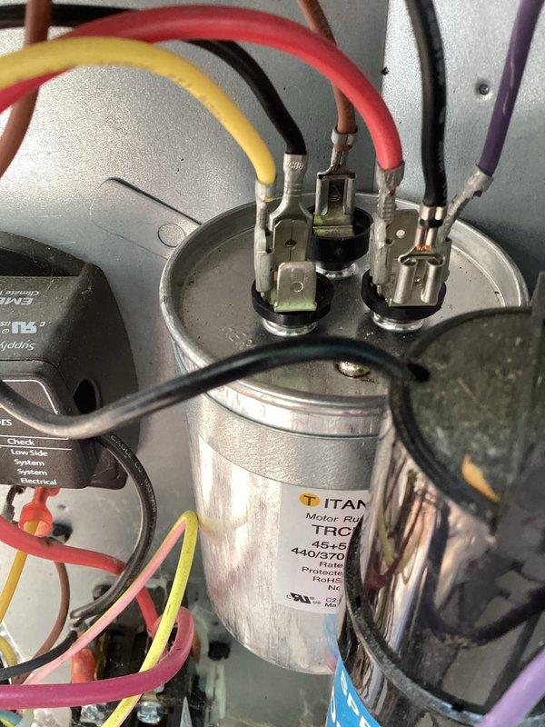 Responded to no cooling call on 5-year-old A/C unit. Found wet switch tripped due to condensate overflow, cleared drain line, reset safety switch, verified proper cooling operation and electrical readings with multimeter.