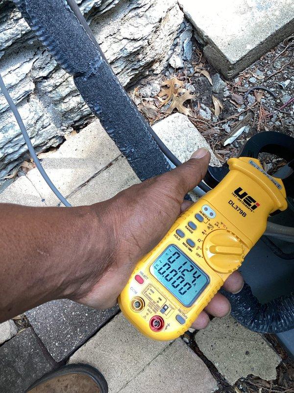 Responded to no cooling call on 5-year-old A/C unit. Found wet switch tripped due to condensate overflow, cleared drain line, reset safety switch, verified proper cooling operation and electrical readings with multimeter.
