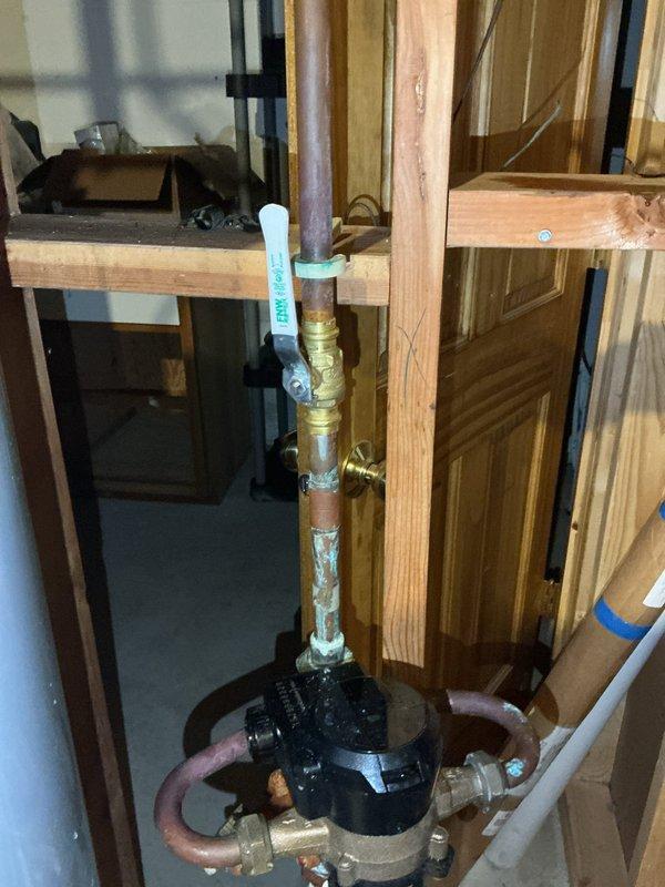 Responded to emergency water service call prior to city water shutdown scheduled for 8am. Replaced four main water shut-off valves on the residential plumbing system to restore proper water flow control and prevent leaks. Installation included brass shut-off valves on copper piping connected to the main water supply line and pressure system. All connections were properly sealed with pipe thread tape and tested for functionality. Work was completed in the basement utility area near the water treatment equipment and water heater to ensure full system operability before city water service was restored.