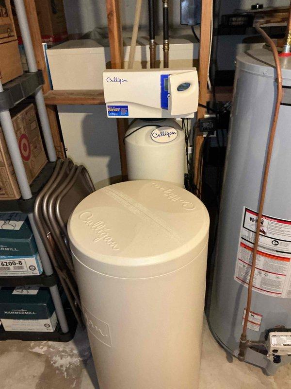 Responded to emergency water service call prior to city water shutdown scheduled for 8am. Replaced four main water shut-off valves on the residential plumbing system to restore proper water flow control and prevent leaks. Installation included brass shut-off valves on copper piping connected to the main water supply line and pressure system. All connections were properly sealed with pipe thread tape and tested for functionality. Work was completed in the basement utility area near the water treatment equipment and water heater to ensure full system operability before city water service was restored.
