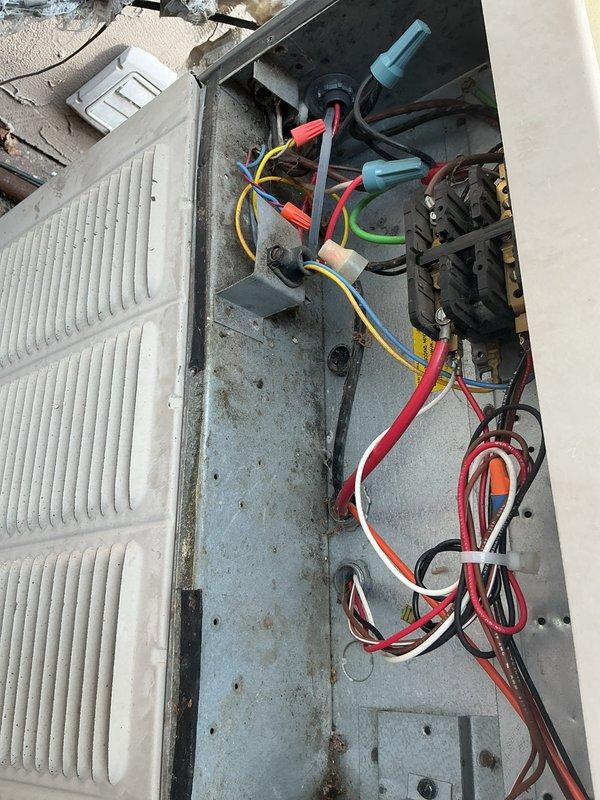 Responded to callback for 15-year-old air conditioning system with no cooling and reported system failure. Upon arrival, unit was operational after customer had reset tripped breaker. Performed comprehensive electrical diagnostics and amp draw testing on compressor circuit. Testing revealed compressor drawing excessive amperage beyond rated specifications, causing circuit breaker to trip under load. Inspected electrical connections, contactors, and capacitor at outdoor unit. Documented equipment condition with photos showing weathered electrical panel, wire connections, and compressor components with visible age-related deterioration including rust and discoloration on metal surfaces. Advised customer that failing compressor poses safety concern and will continue to trip breaker, resulting in system failure. Scheduled appointment with comfort advisor to review replacement options for aging system.