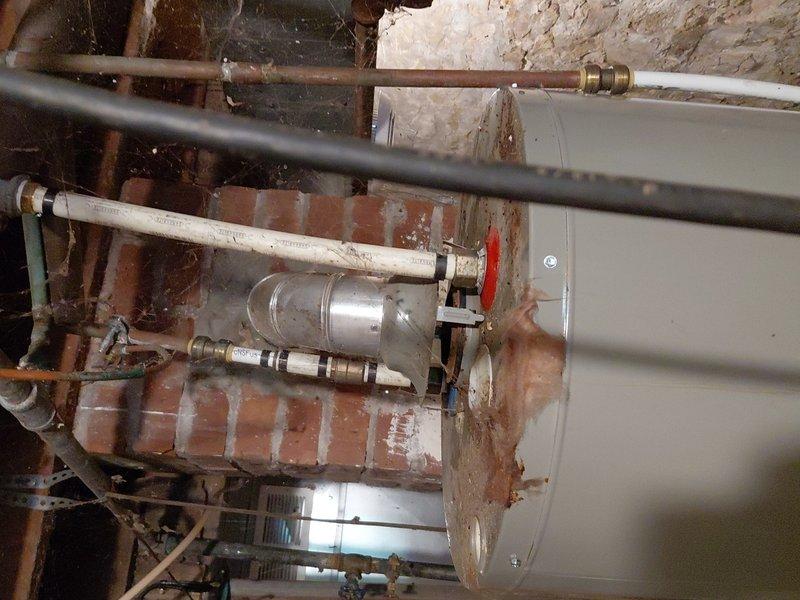 Responded to service call for leaking water heater in basement utility area. Upon inspection, determined existing 40-gallon natural gas standard vent water heater had failed and required complete replacement. Provided pricing estimate to customer for approval prior to commencing work. Proceeded with full removal of defective unit and installation of new 40-gallon natural gas standard vent water heater. Connected all supply and discharge piping, verified proper venting configuration, and tested all connections for leaks. System restored to full operational status.