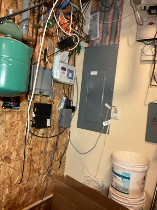 Completed annual cooling system maintenance and tuneup on residential air conditioning unit with all components operating within specifications. Diagnosed and replaced failed expansion tank on garage boiler system due to active leak, then refilled and pressure-tested the hydronic system. Upon startup attempt, boiler displayed combustion blower fault code; troubleshooting confirmed blower motor failure requiring parts order and replacement during scheduled fall furnace maintenance visit per customer request to consolidate all remaining service work.