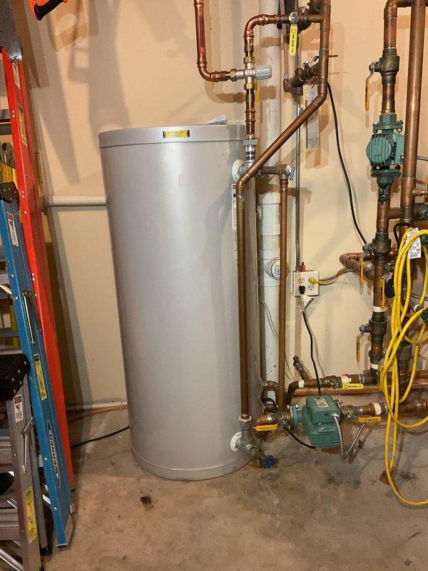 Completed annual cooling system maintenance and tuneup on residential air conditioning unit with all components operating within specifications. Diagnosed and replaced failed expansion tank on garage boiler system due to active leak, then refilled and pressure-tested the hydronic system. Upon startup attempt, boiler displayed combustion blower fault code; troubleshooting confirmed blower motor failure requiring parts order and replacement during scheduled fall furnace maintenance visit per customer request to consolidate all remaining service work.