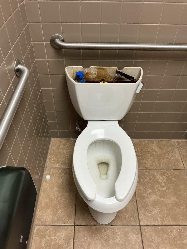 Responded to service call for toilet with rusting mounting hardware. Removed and reset toilet, replacing corroded closet bolts and wax ring seal. Upon inspection, found significant rust on toilet flange and deteriorated mounting screws that compromised the fixture's stability. Removed toilet from flange, cleaned work area, installed new wax ring, and properly secured toilet with new stainless steel closet bolts and hardware to ensure watertight seal and prevent future corrosion issues.