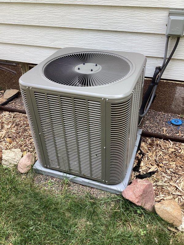 Completed preventative maintenance tune-up on residential air conditioning system installed one year ago. Outdoor condenser unit was found with significant dirt accumulation; performed thorough cleaning of unit and verified all components operating within normal parameters. No deficiencies identified; system functioning properly with no repairs required.