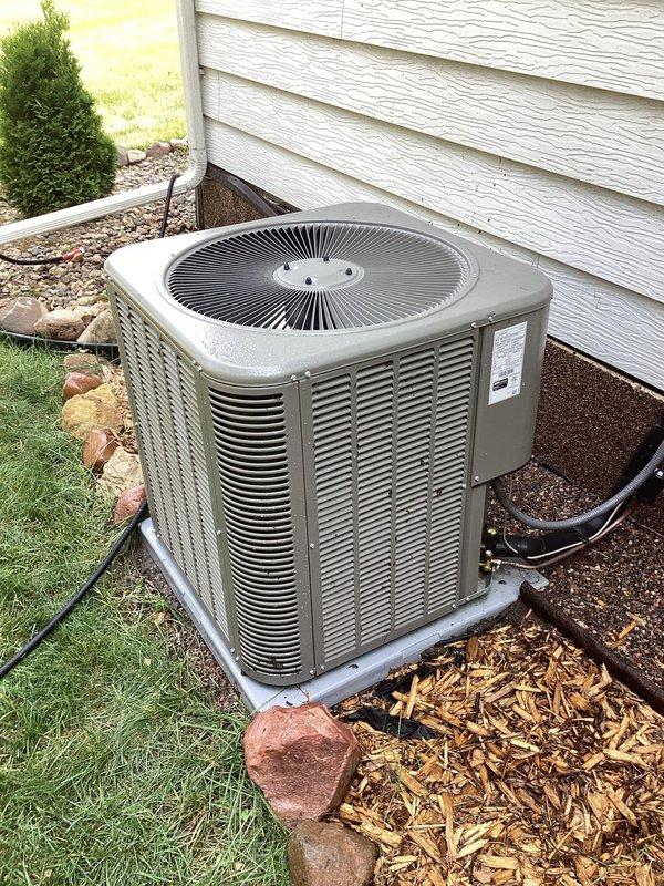 Completed preventative maintenance tune-up on residential air conditioning system installed one year ago. Outdoor condenser unit was found with significant dirt accumulation; performed thorough cleaning of unit and verified all components operating within normal parameters. No deficiencies identified; system functioning properly with no repairs required.