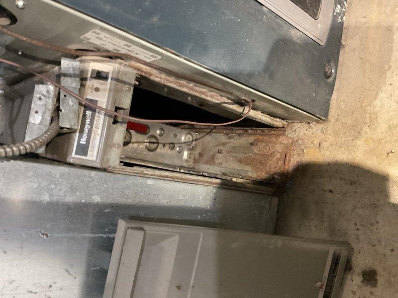 Responded to a no-cool complaint on a 1993 R-22 air conditioning system. Verified recently replaced outdoor fan capacitor and compressor capacitor were both within rated specifications. Performed refrigeration circuit diagnostics using Job Link probes, which revealed suction pressure of approximately 38 psig on 87°F ambient temperature with warm suction line, confirming critically low refrigerant charge preventing adequate cooling. Due to system age and R-22 being a phased-out refrigerant, recommended system replacement rather than repair. 

Additionally inspected Honeywell electronic air cleaner and discovered airflow blockage caused by a bag and debris lodged behind electrode panel. Removed obstructions to restore proper airflow through air cleaning system. Coordinated replacement consultation to review new equipment options.