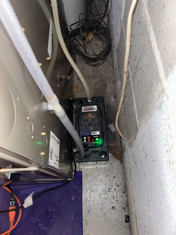 Responded to callback for furnace water leak following previous A/C repair. Diagnosed disconnected condensate pump discharge hose causing water to leak from unit bottom. Reattached condensate hose to proper connection point and verified proper drainage to sink with water test. Tested electrical circuit and condensate pump operation, confirming normal function with no additional issues found.