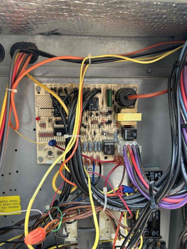 Responded to no cooling call on second floor rooftop unit. Found RTU not starting with compressor and condenser fans failing to run. Performed diagnostic testing on contactors and capacitors, which tested normal. Attempted jumper test at thermostat with no response from equipment. Installed new thermostat but unit still failed to operate. Traced issue to failed control board in electrical panel. Determined failed board likely damaged original thermostat. Installed replacement thermostat and identified control board requiring replacement. Provided recommendation for new control board installation to restore unit operation.