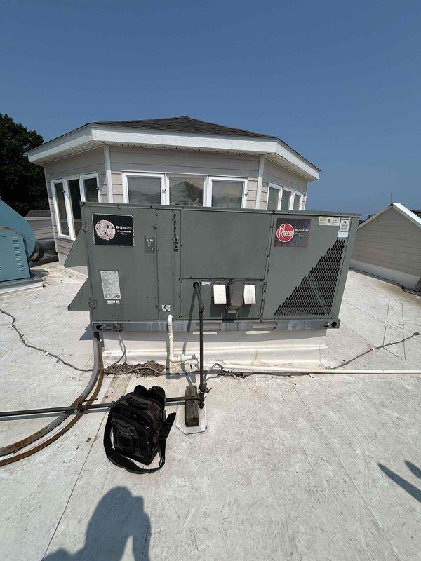 Responded to no cooling call on second floor rooftop unit. Found RTU not starting with compressor and condenser fans failing to run. Performed diagnostic testing on contactors and capacitors, which tested normal. Attempted jumper test at thermostat with no response from equipment. Installed new thermostat but unit still failed to operate. Traced issue to failed control board in electrical panel. Determined failed board likely damaged original thermostat. Installed replacement thermostat and identified control board requiring replacement. Provided recommendation for new control board installation to restore unit operation.